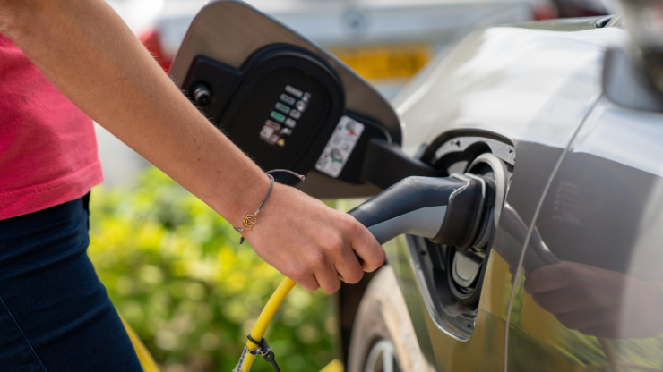 EV charging cable connected to electric vehicle, illustrating EV charger circuit installation.